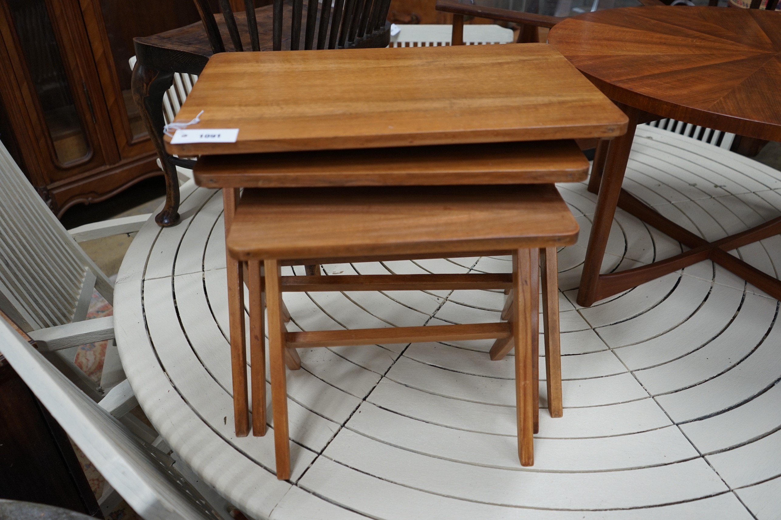 A mid century design nest of three rectangular tea tables, width 54cm, depth 35cm, height 50cm